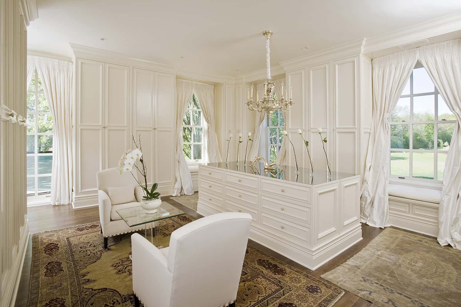 master dressing room with deluxe white cabinetry