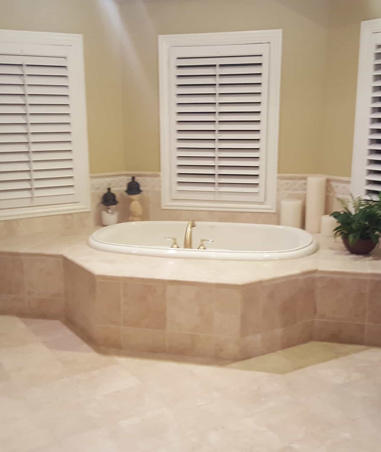 old dated bathtub with tub deck