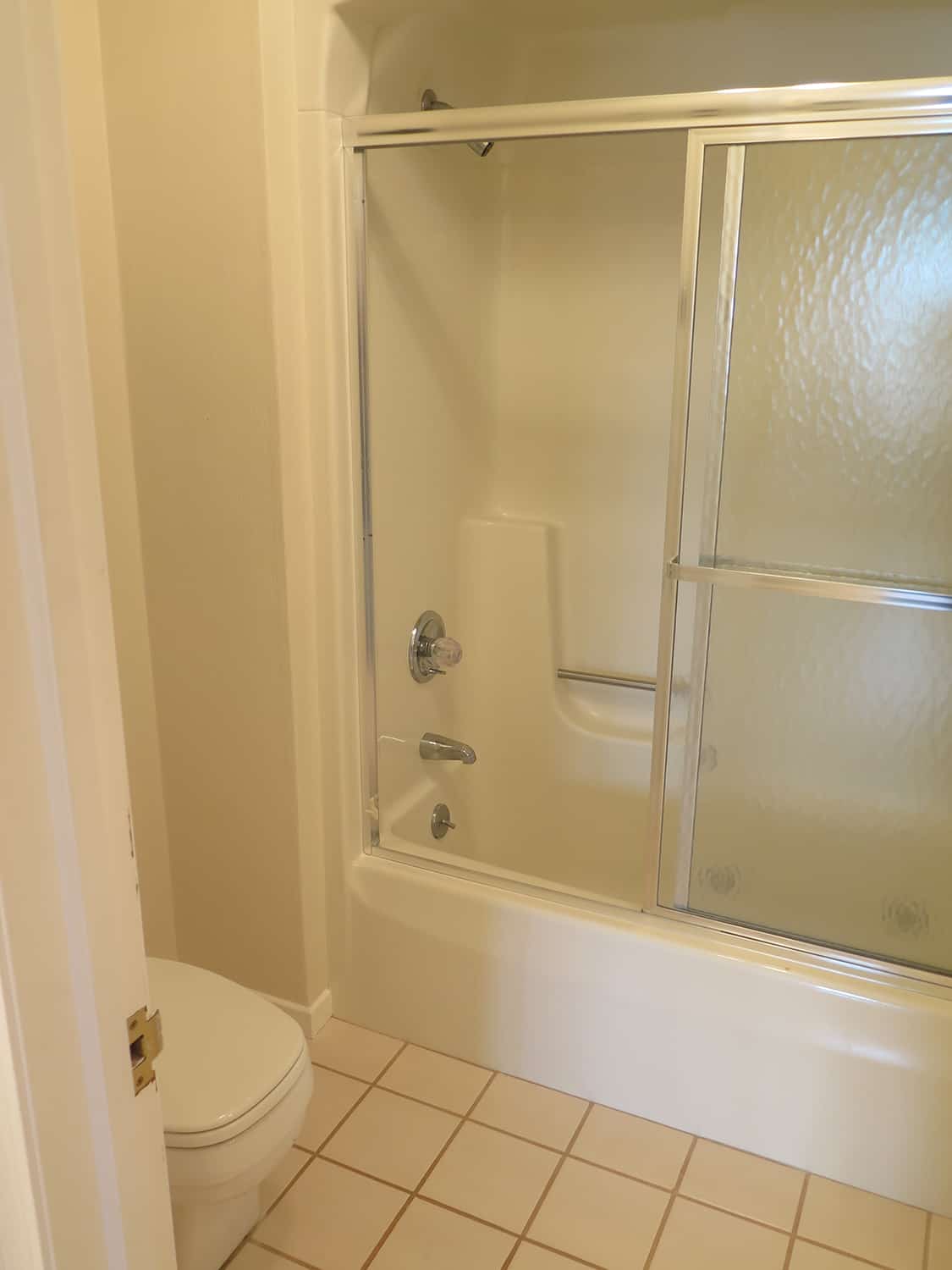 old tub shower combo with dated slider