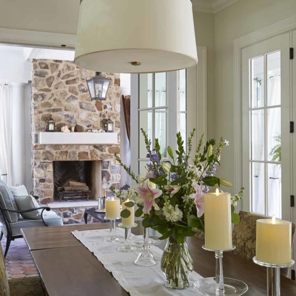 screen porch with stone fireplace
