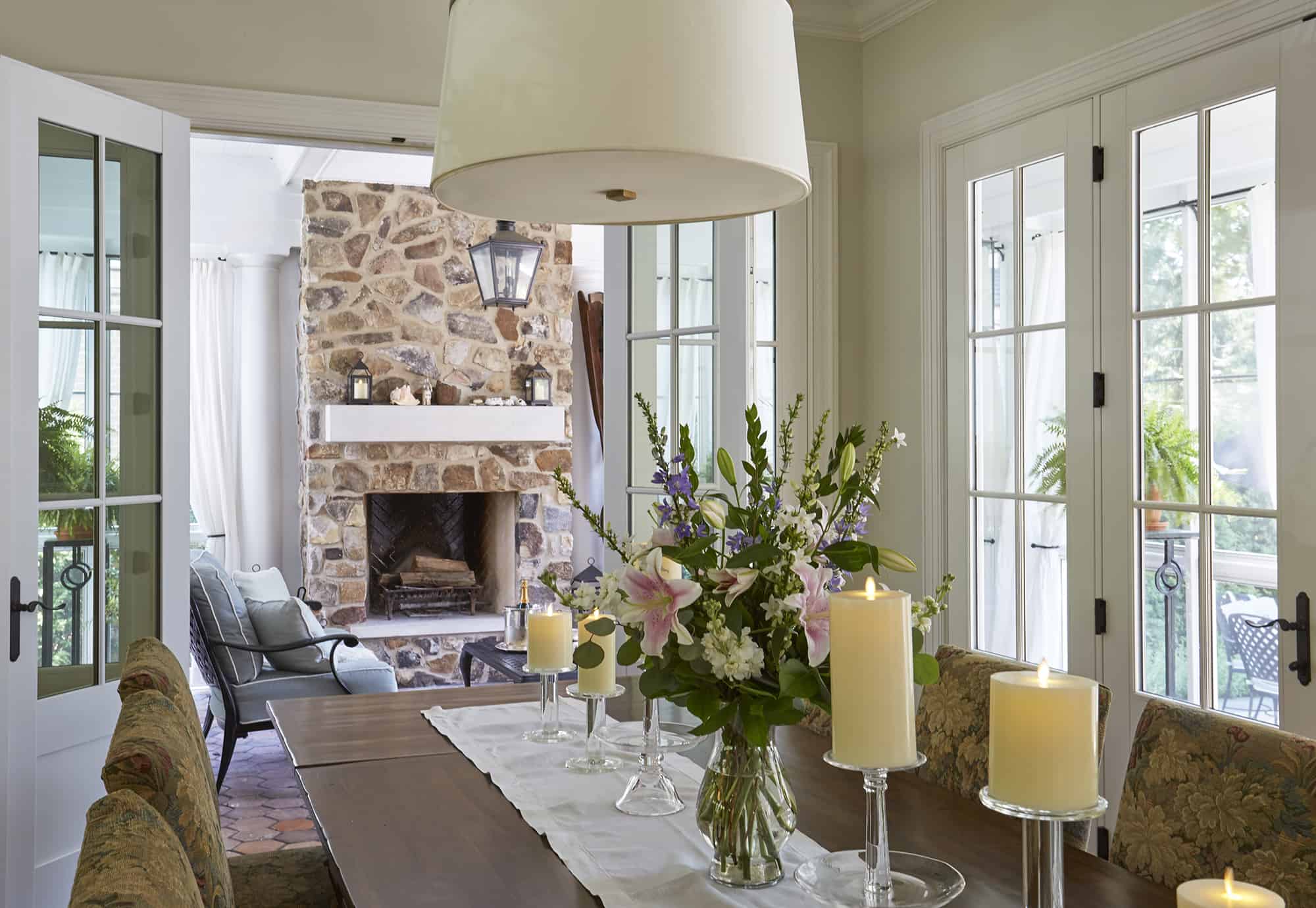 screen porch with stone fireplace