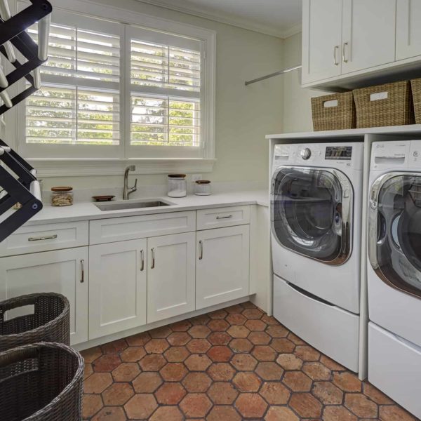 laundry room with hex floor tile