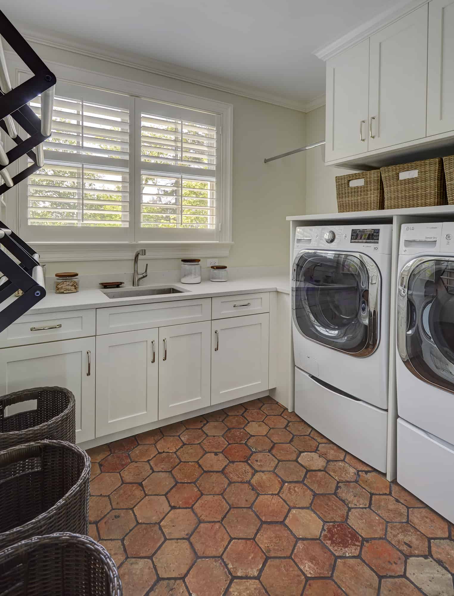 laundry room with hex floor tile