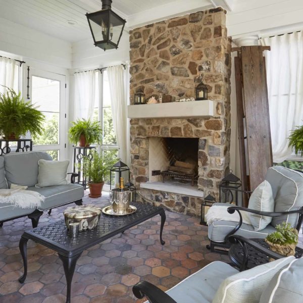 stone fireplace on screen porch