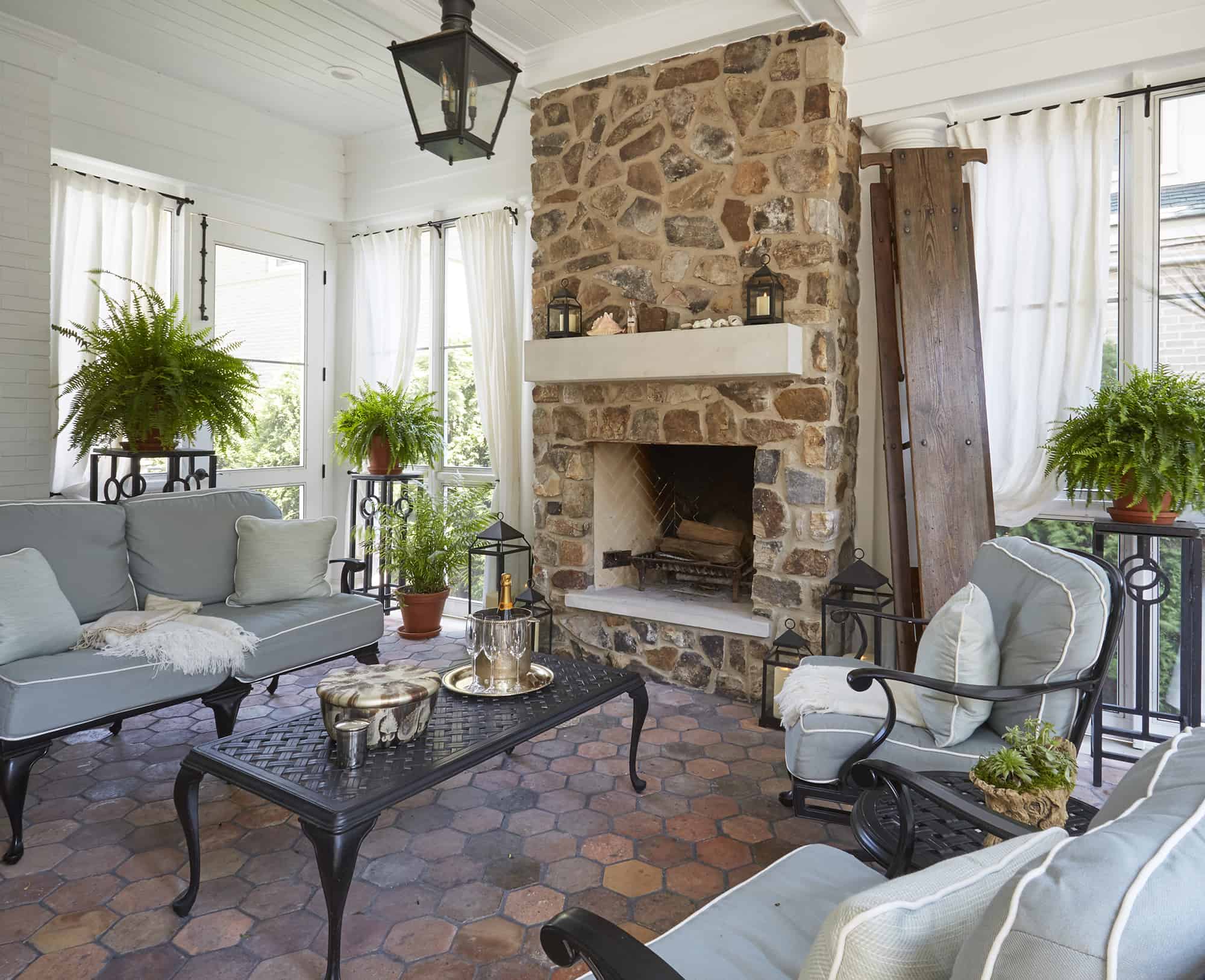 stone fireplace on screen porch