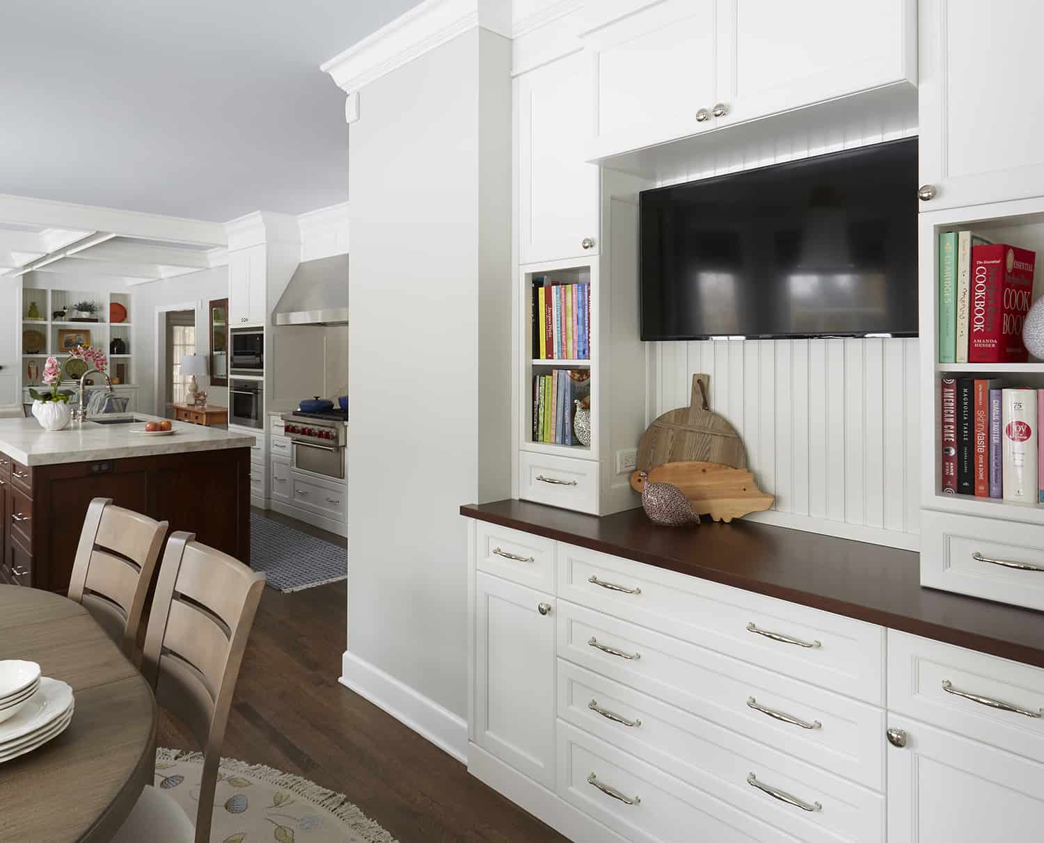 built in buffet in dining room with tv