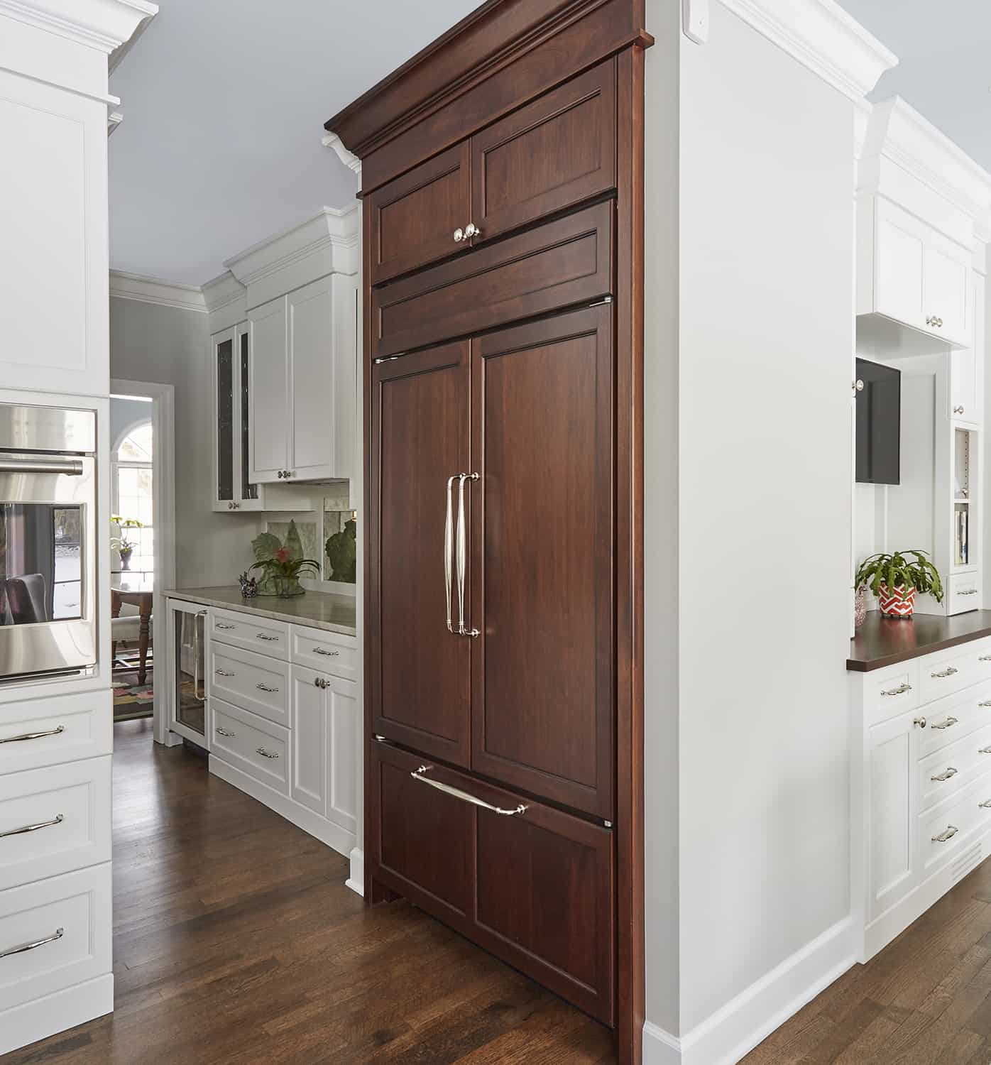 dark wood paneled refrigerator