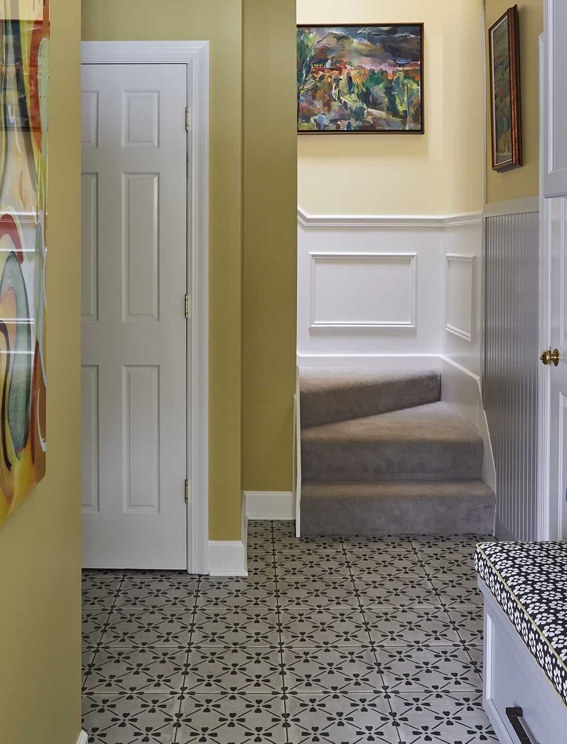 curving stairs in mudroom