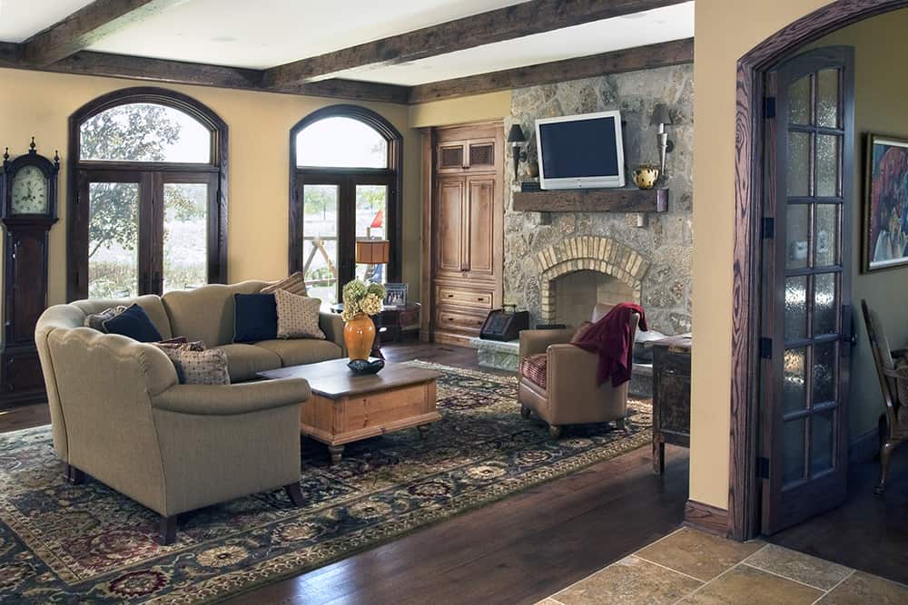 traditional living room with stone fireplace