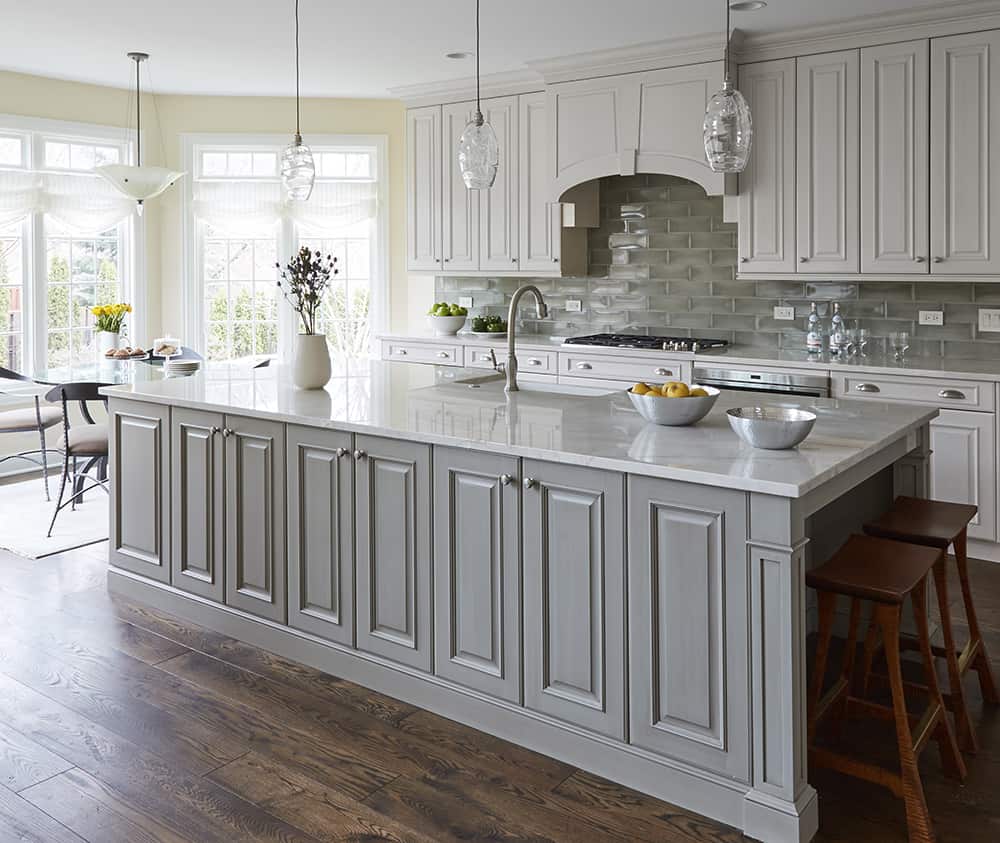 gray kitchen island with white perimeter cabinets