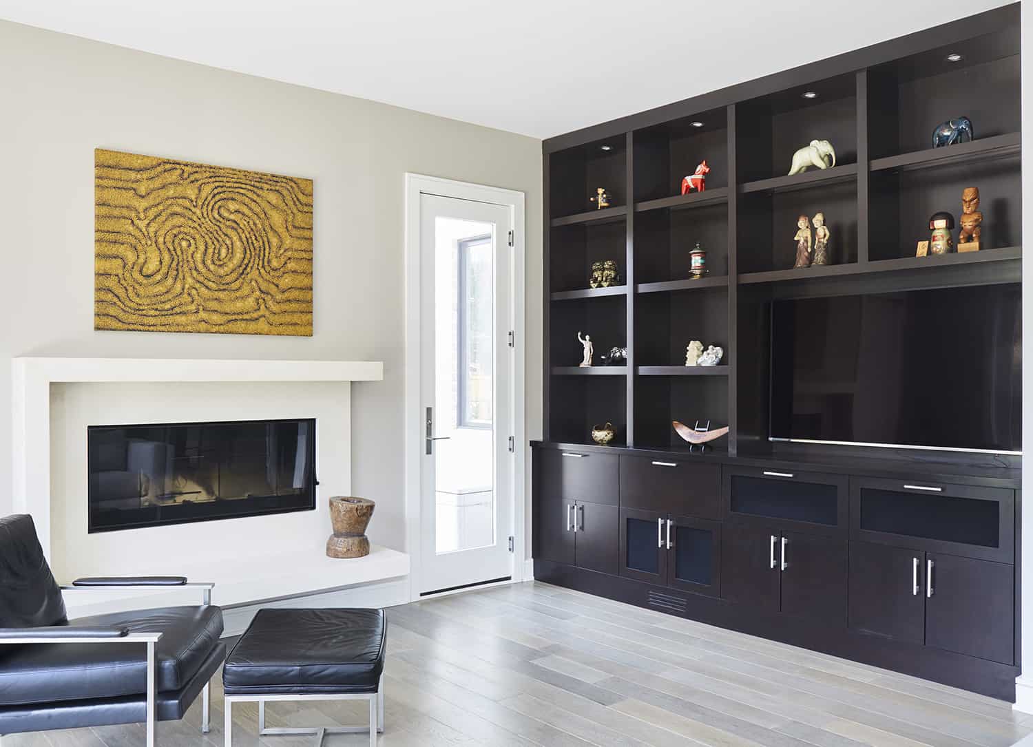 media wall in dark wood with white modern fireplace