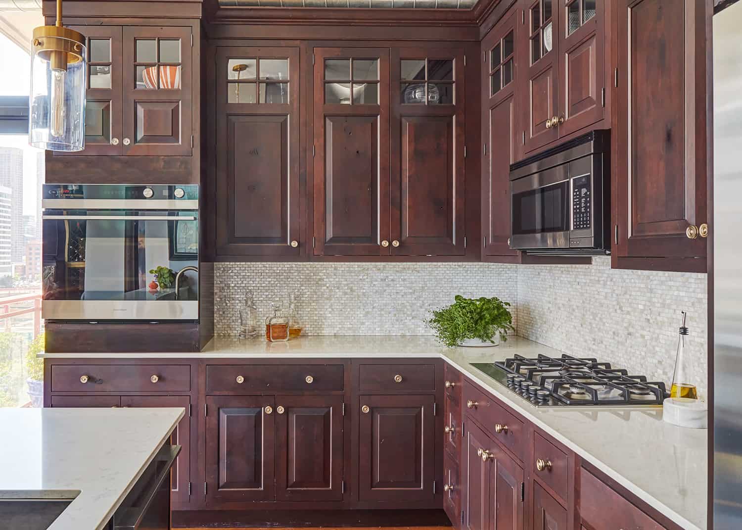 dark reddish brown cabinets with raised fronts