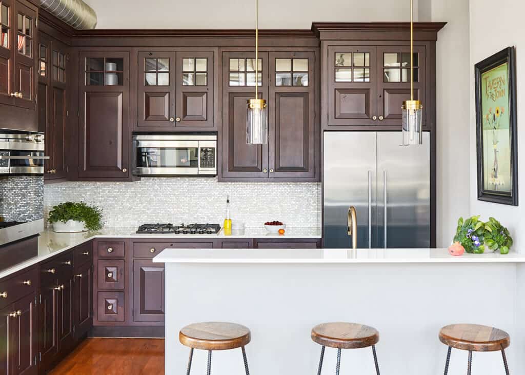 dark wood cabinets with partial glass front uppers