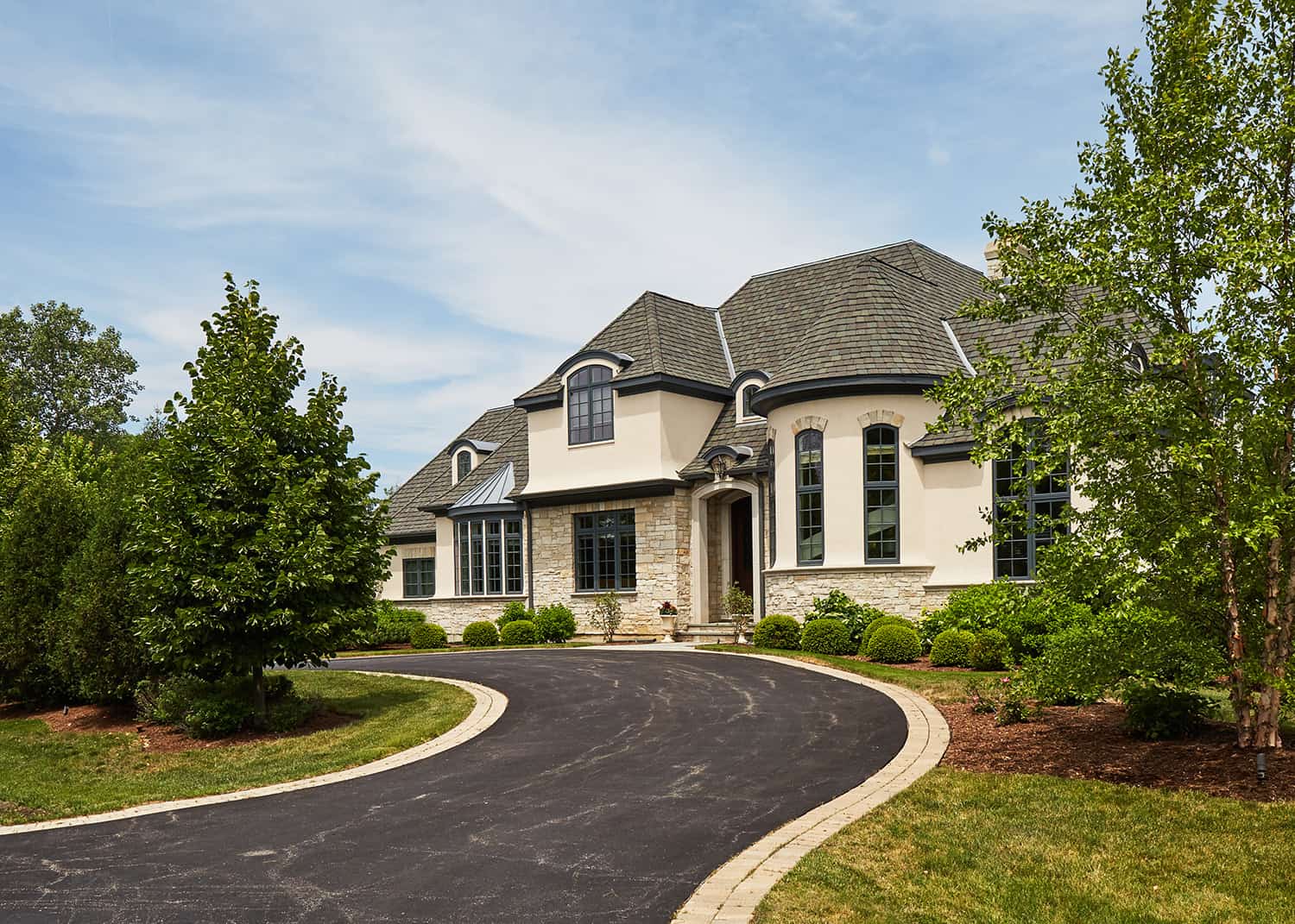 sweeping driveway to french country estate