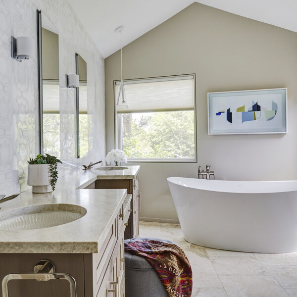 large white soaking tub under vaulted ceiling
