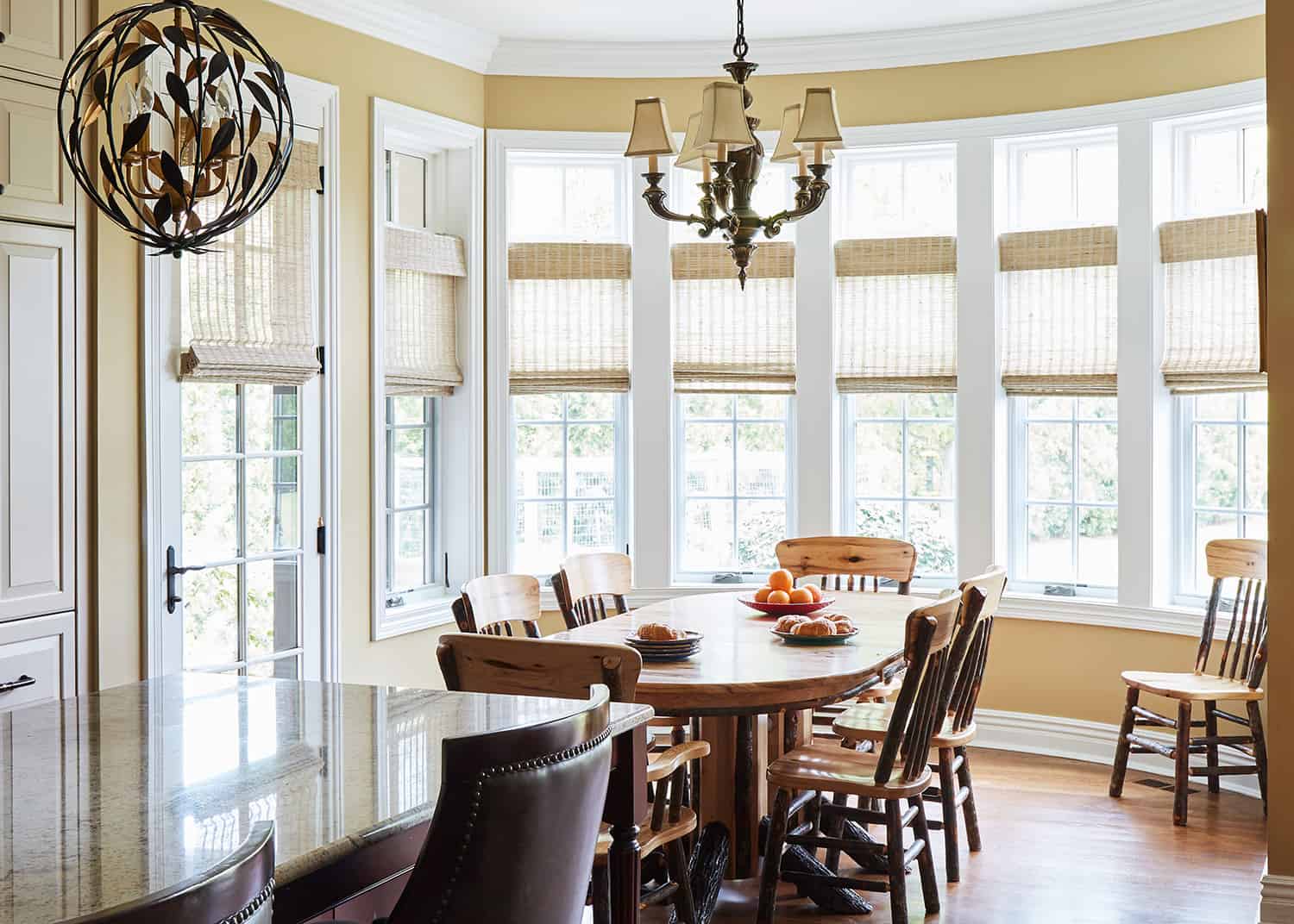 sunny breakfast room with wood table