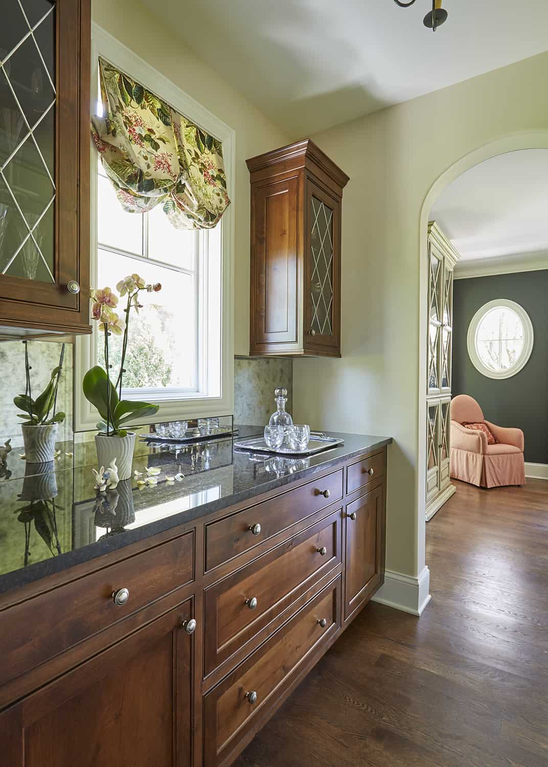 dark wood cabinets with leaded glass doors