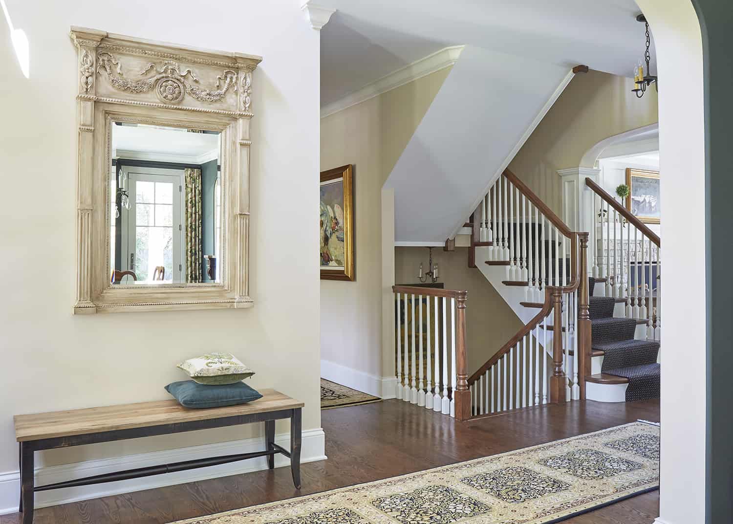 foyer with mirror and bench