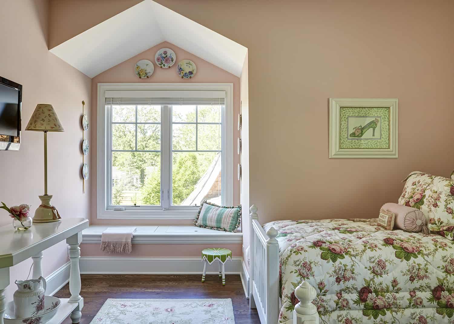 pink bedroom with window seat