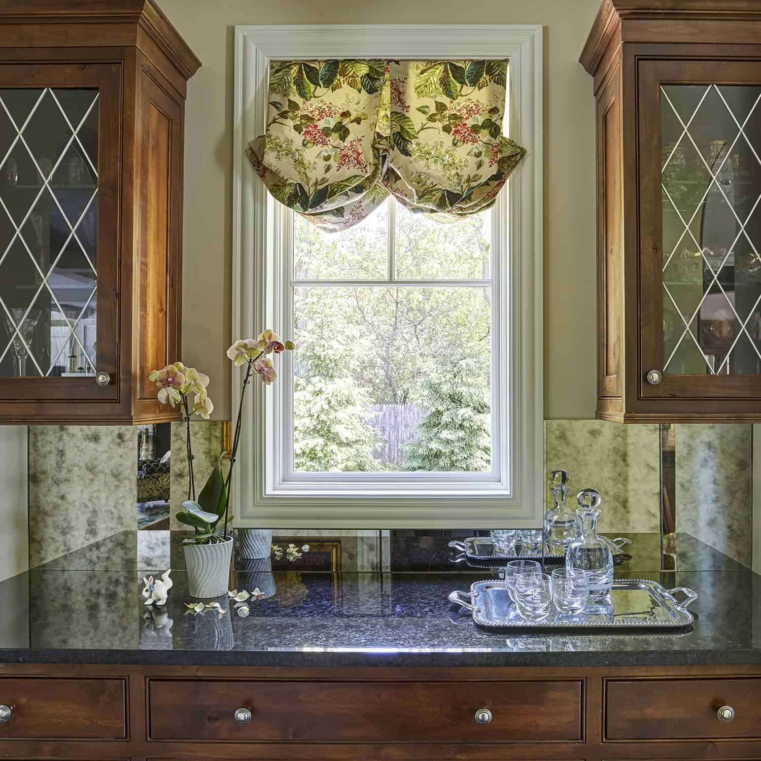 dark wood cabinets with leaded glass doors