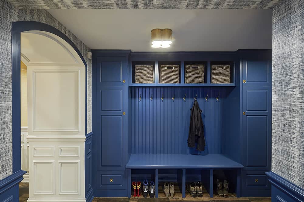 lower level mudroom with blue cabinets