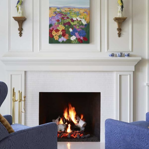 primary-suite-sitting-room fireplace in primary sitting room