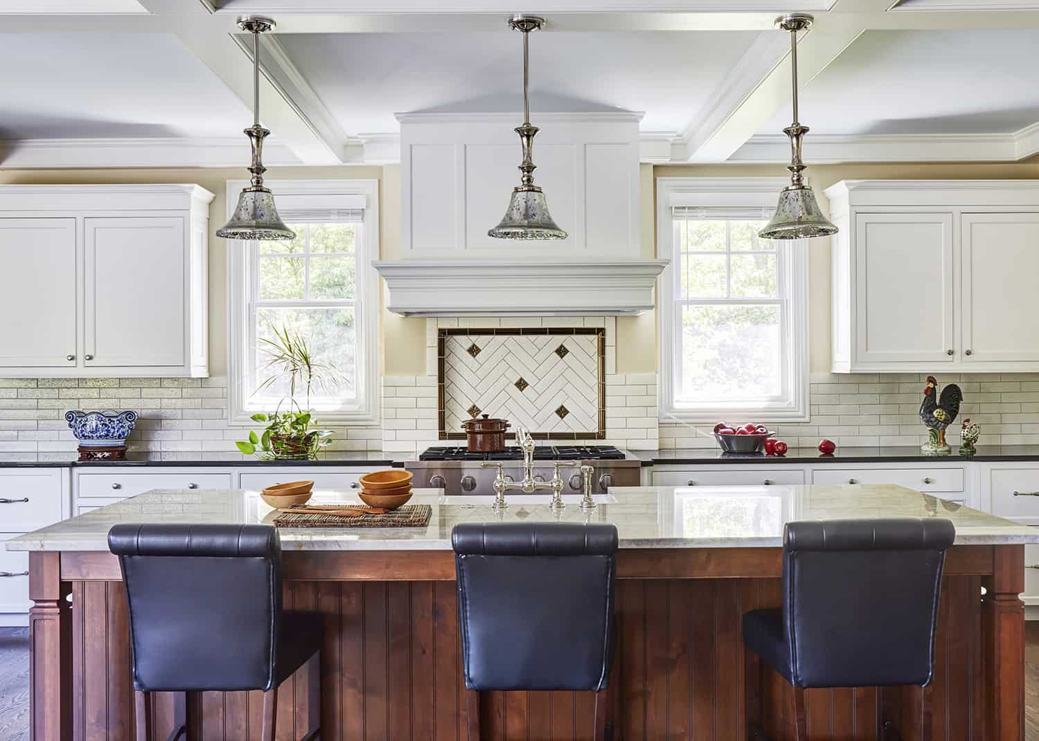 kitchen island with three pendant lights above