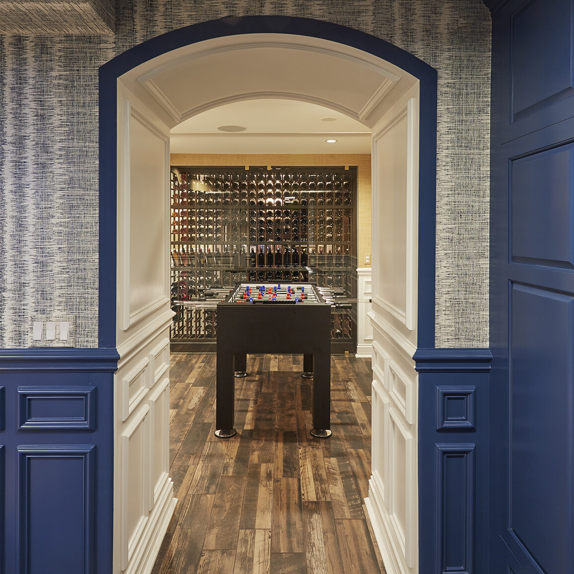 arched opening to game room