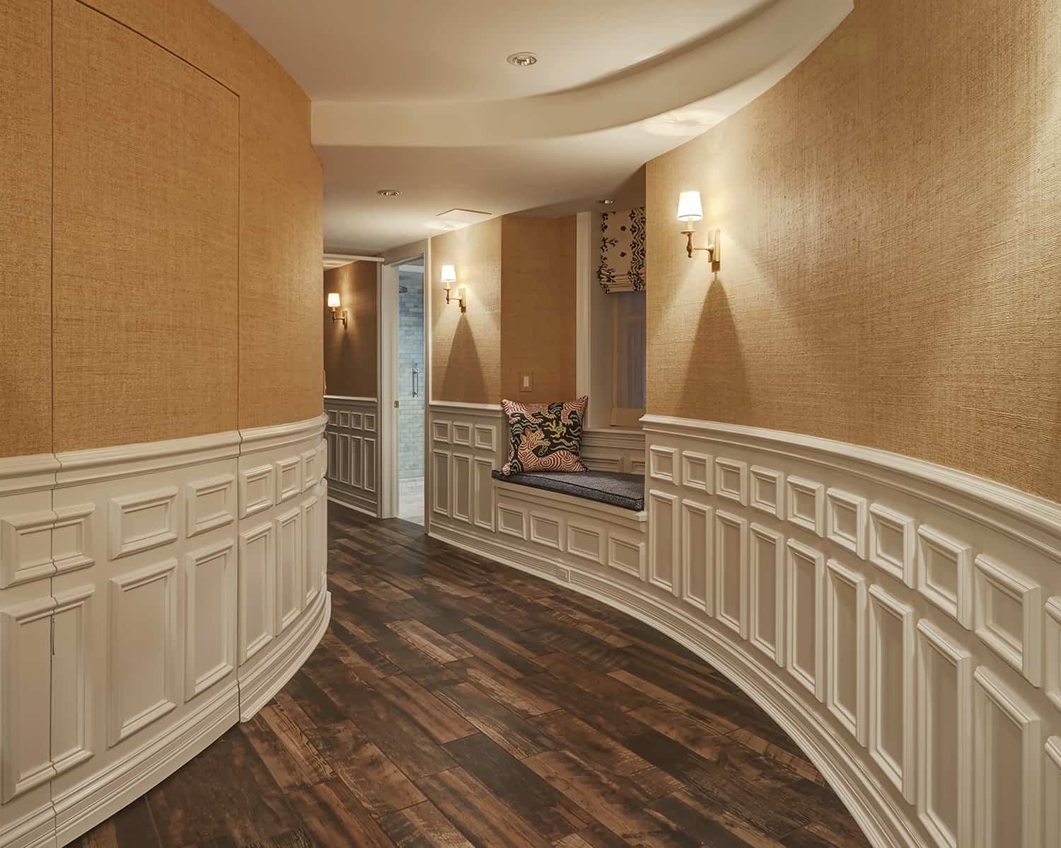 lower level curved hallway with heavy wainscot