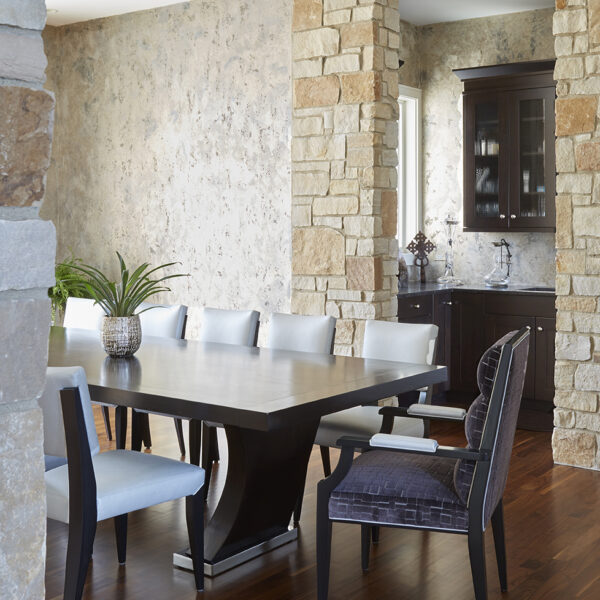 dining-room-view-to-butlers-pantry dining room table with captain's chair pulled out