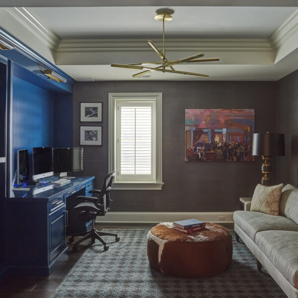 lower-level-home-office home office with blue built-in cabinets