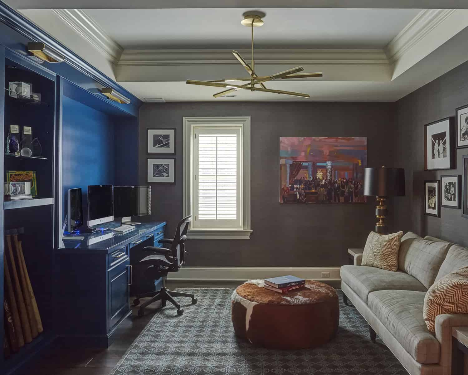 home office with blue built-in cabinets