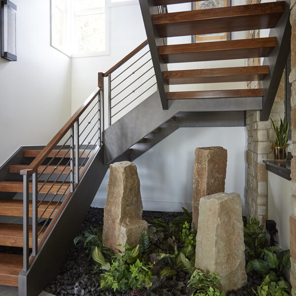 stair-detail-metal-balusters-wood-handrail lower level stair
