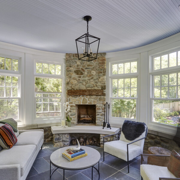 wilmette-porch-additon-orren-pickell sunroom addition with stone fireplace
