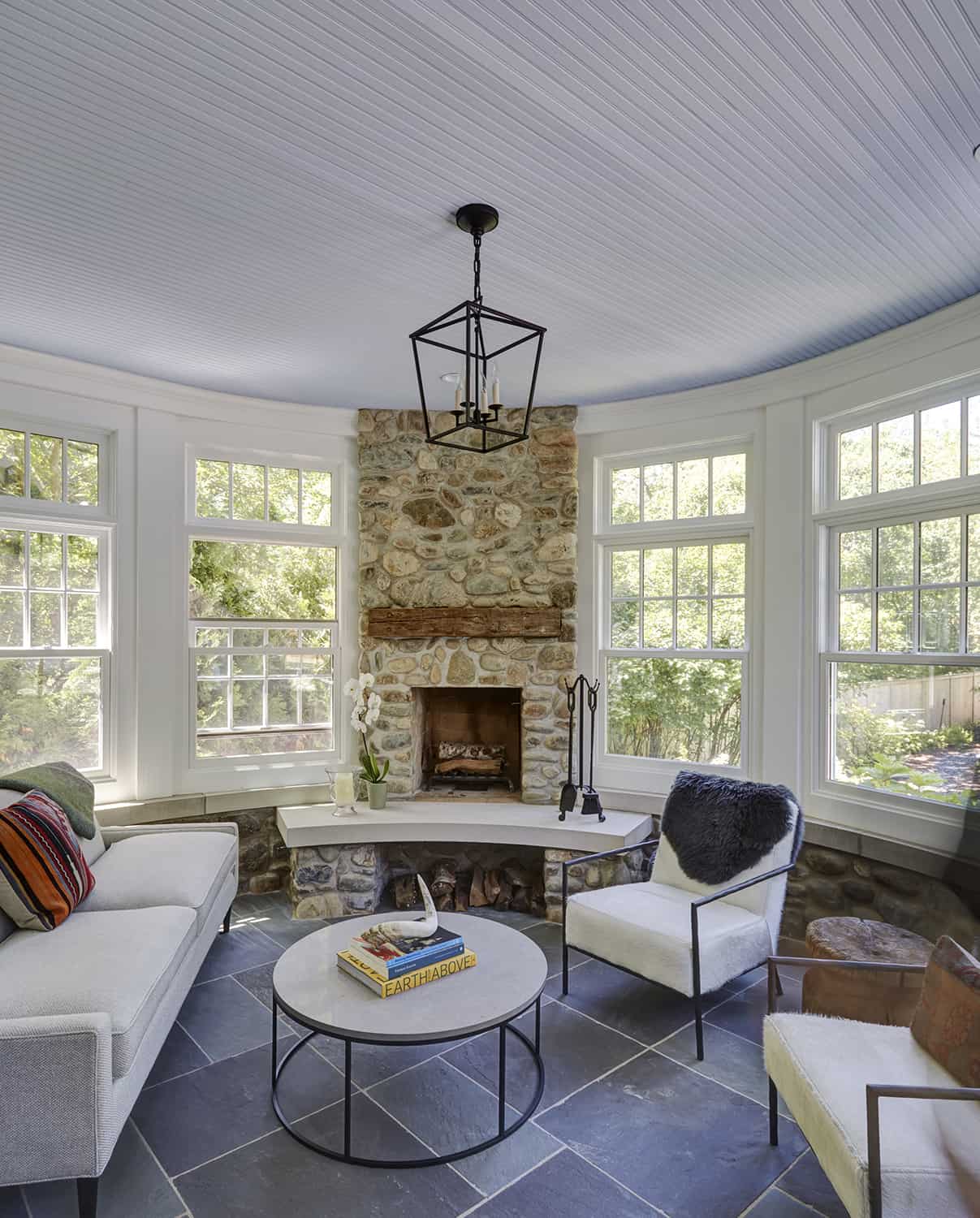 sunroom addition with stone fireplace