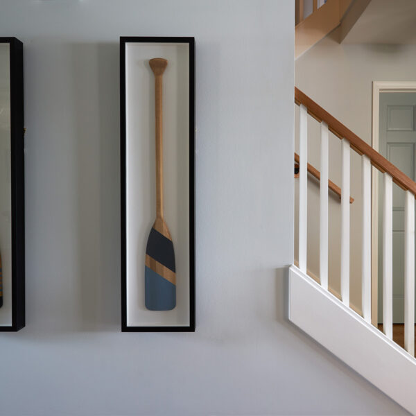 painted oars framed as wall art