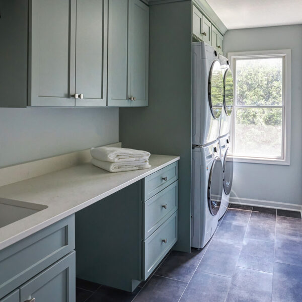 laundry room with two washers and two dryers