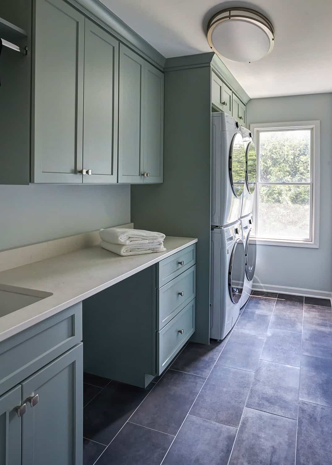 laundry room with two washers and two dryers