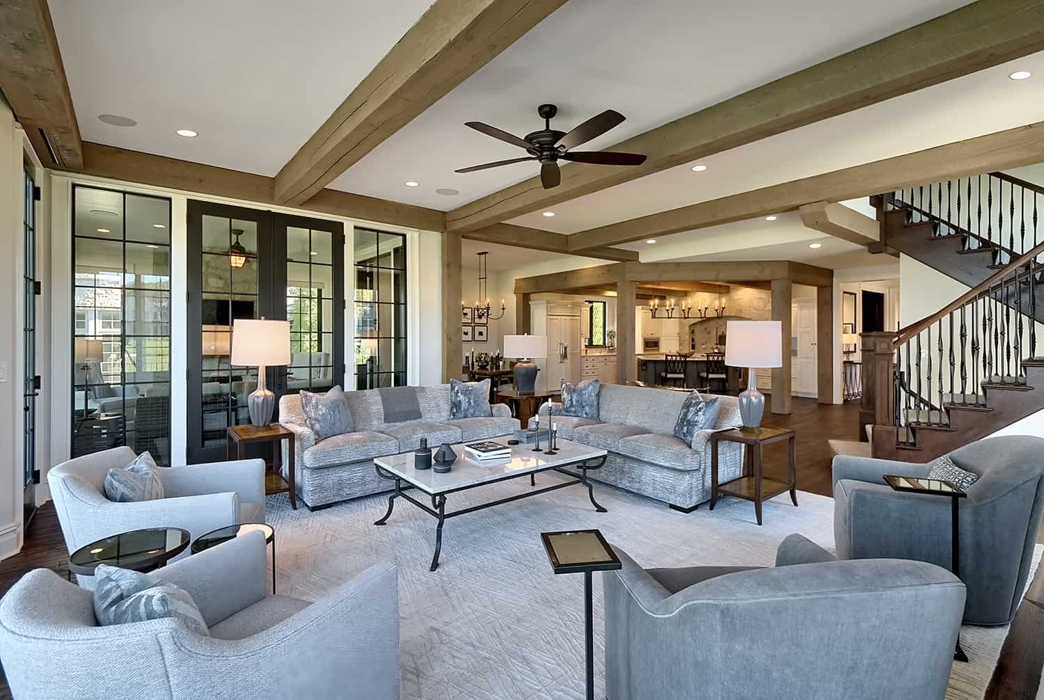 open concept living room with beamed ceiling