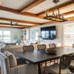 open concept great room with ceiling beams