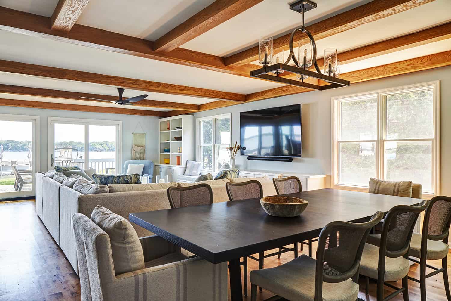 open concept great room with ceiling beams