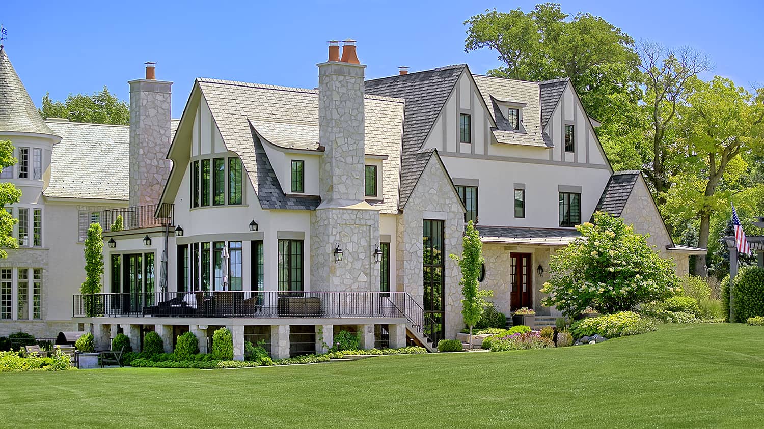 stone and stucco exterior of lakefront home