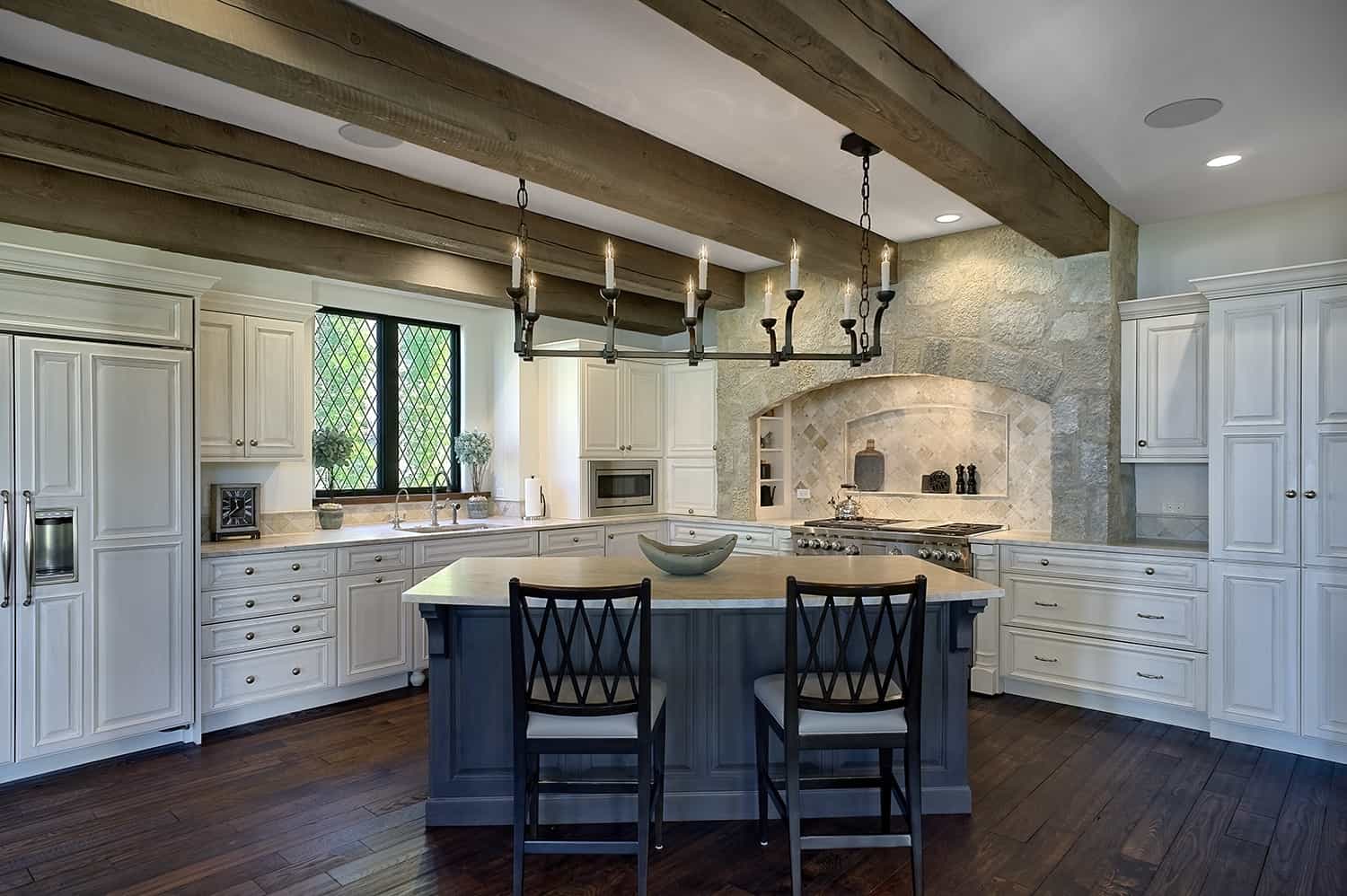 blue island in kitchen with exposed beams