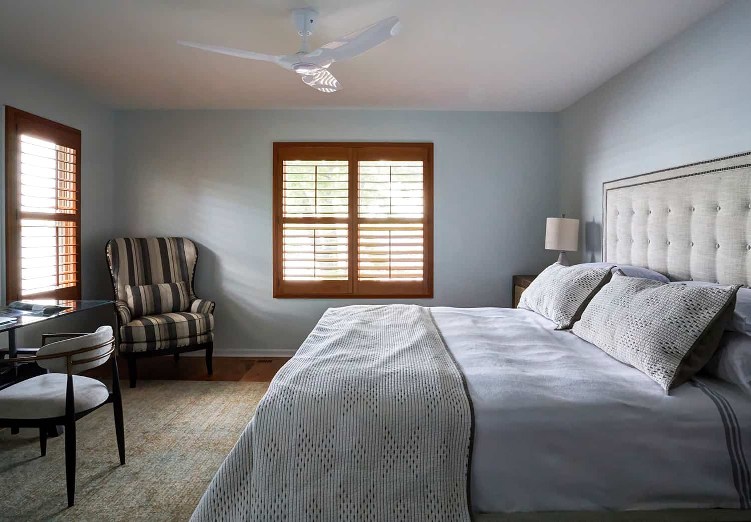 striped chair in bedroom