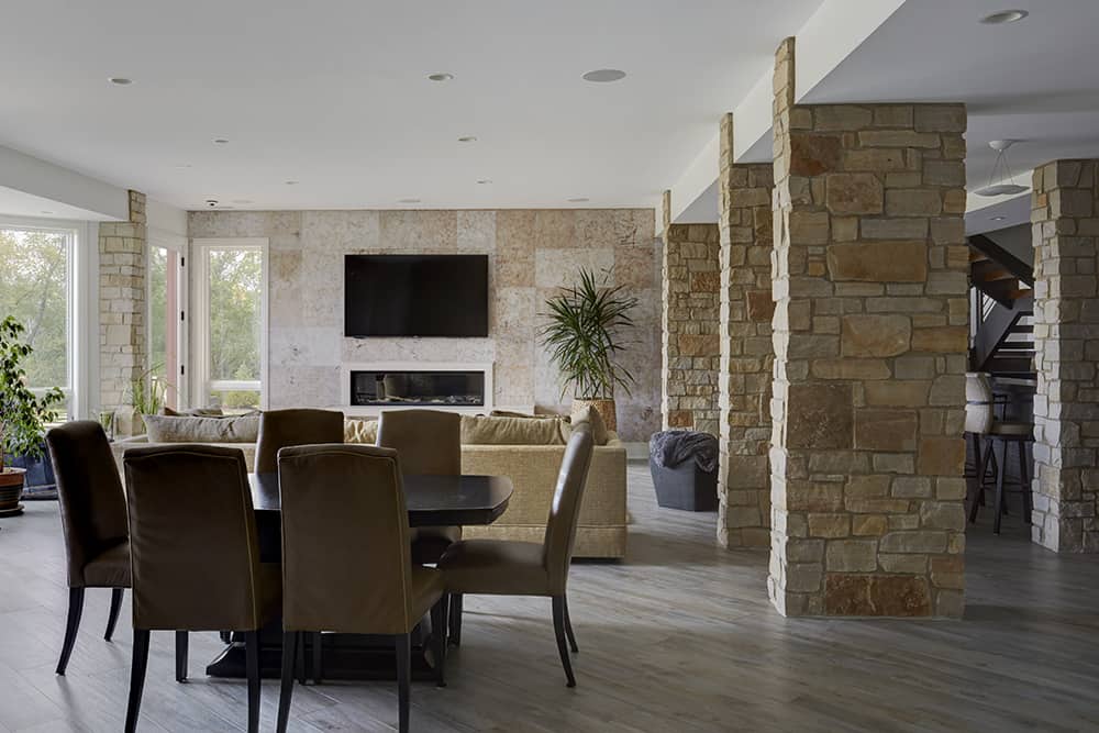 basement with stone columns and stone floors