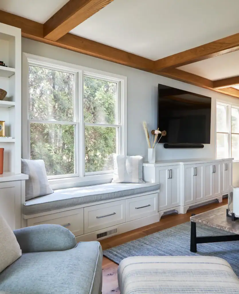Picture of a bright living room with a white window seat