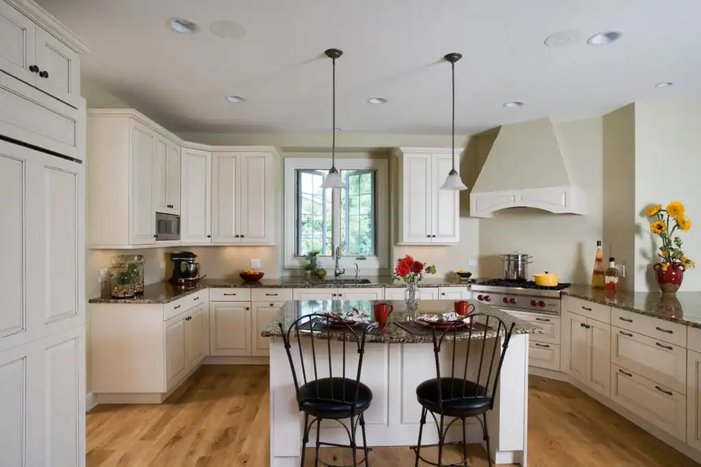 Picture of a kitchen with white cabinets and a center island
