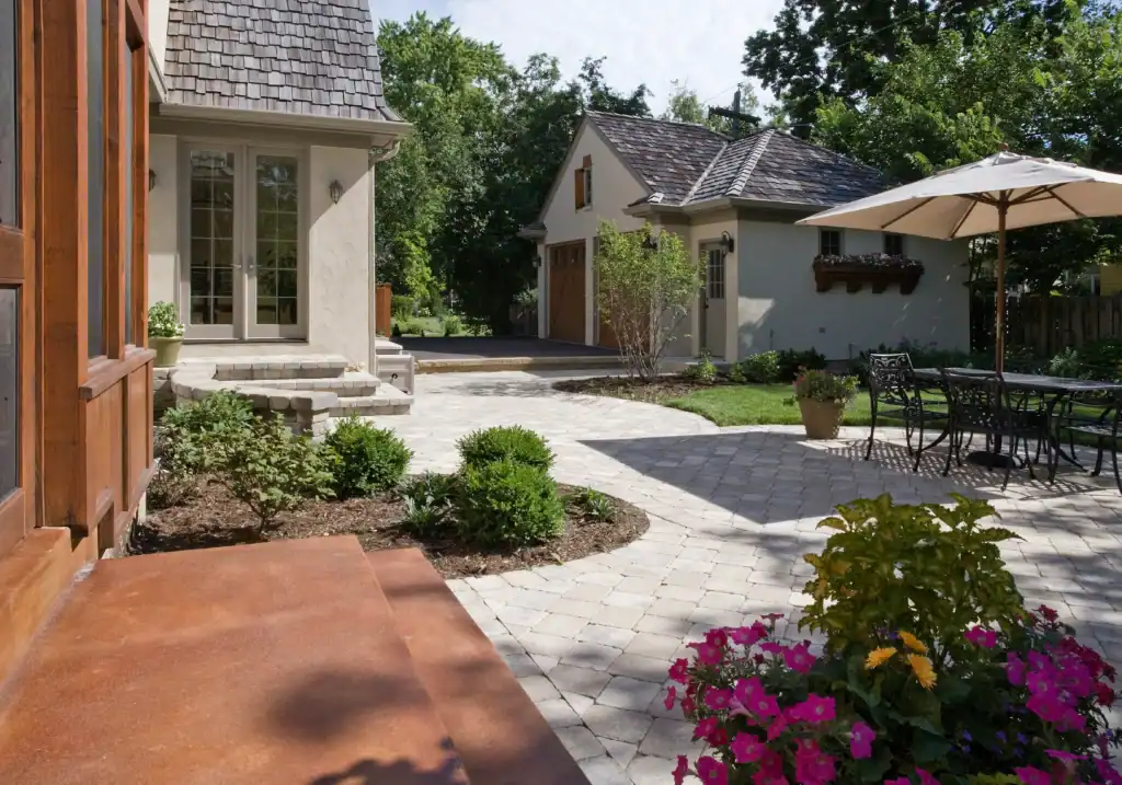 Picture of a paved courtyard patio with a detached garage