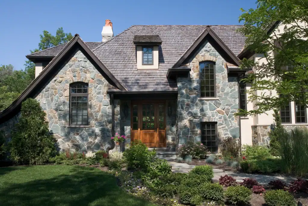 Picture of a stone house exterior with wooden front door
