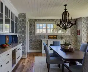 Picture of a dining room with blue patterned wallpaper